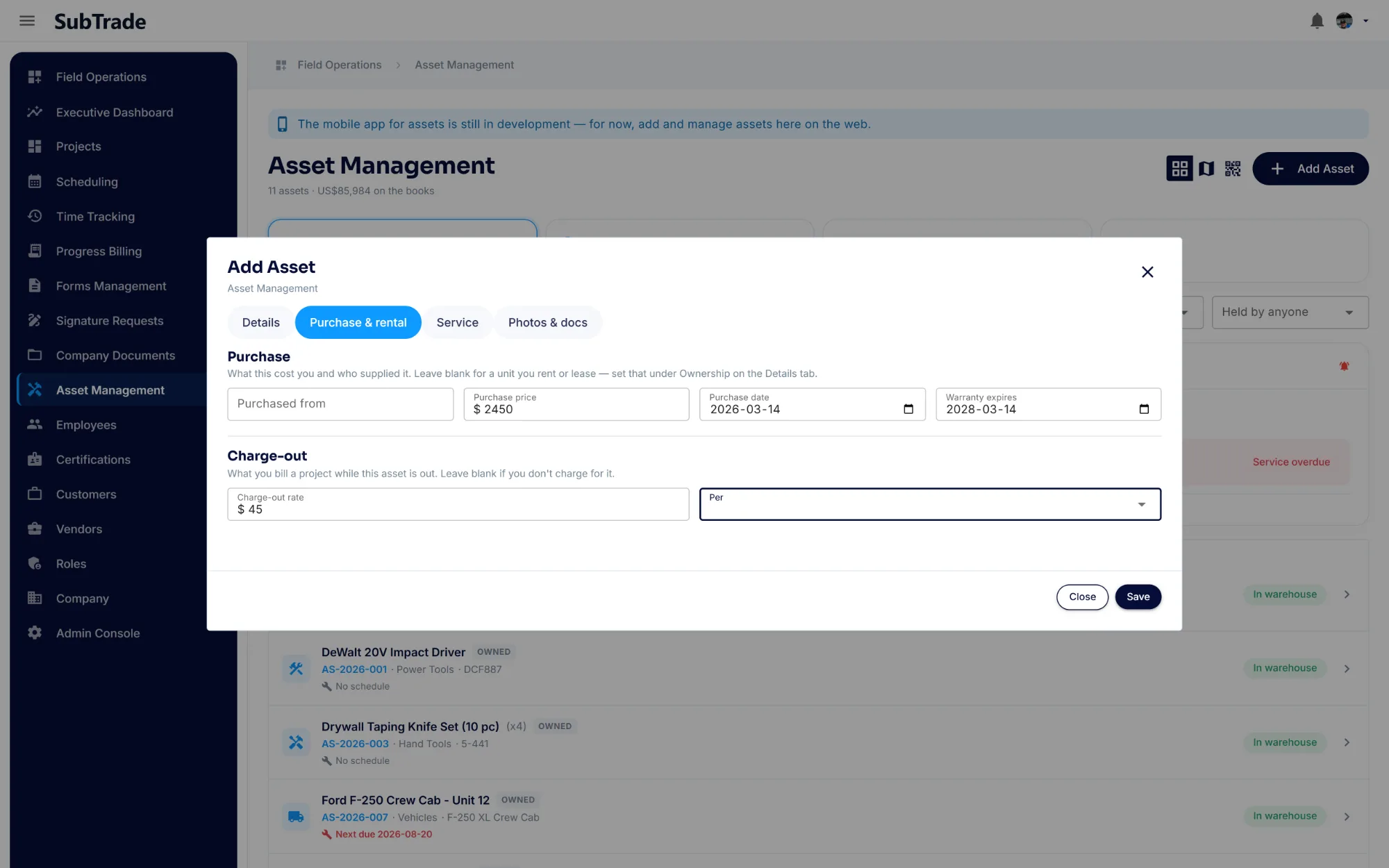 The Purchase and rental tab of the SubTrade asset dialog showing purchase price, purchase date, warranty expiry and a charge-out rate billed to a project