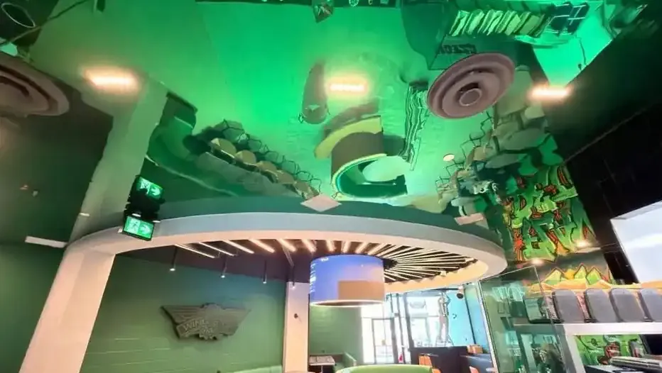 After photo: the same restaurant finished, ceiling painted and seating installed