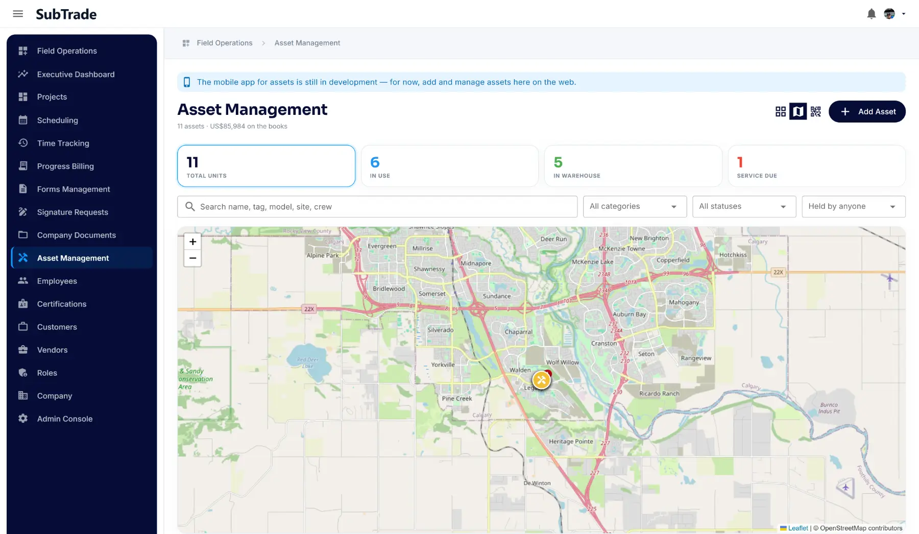 The map view in SubTrade Asset Management showing a located piece of equipment pinned on a job site across a city-wide view, with six units counted as in use