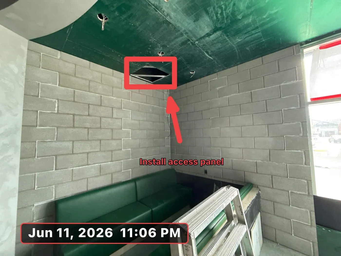 Site photo marked up in SubTrade with an arrow and install access panel note